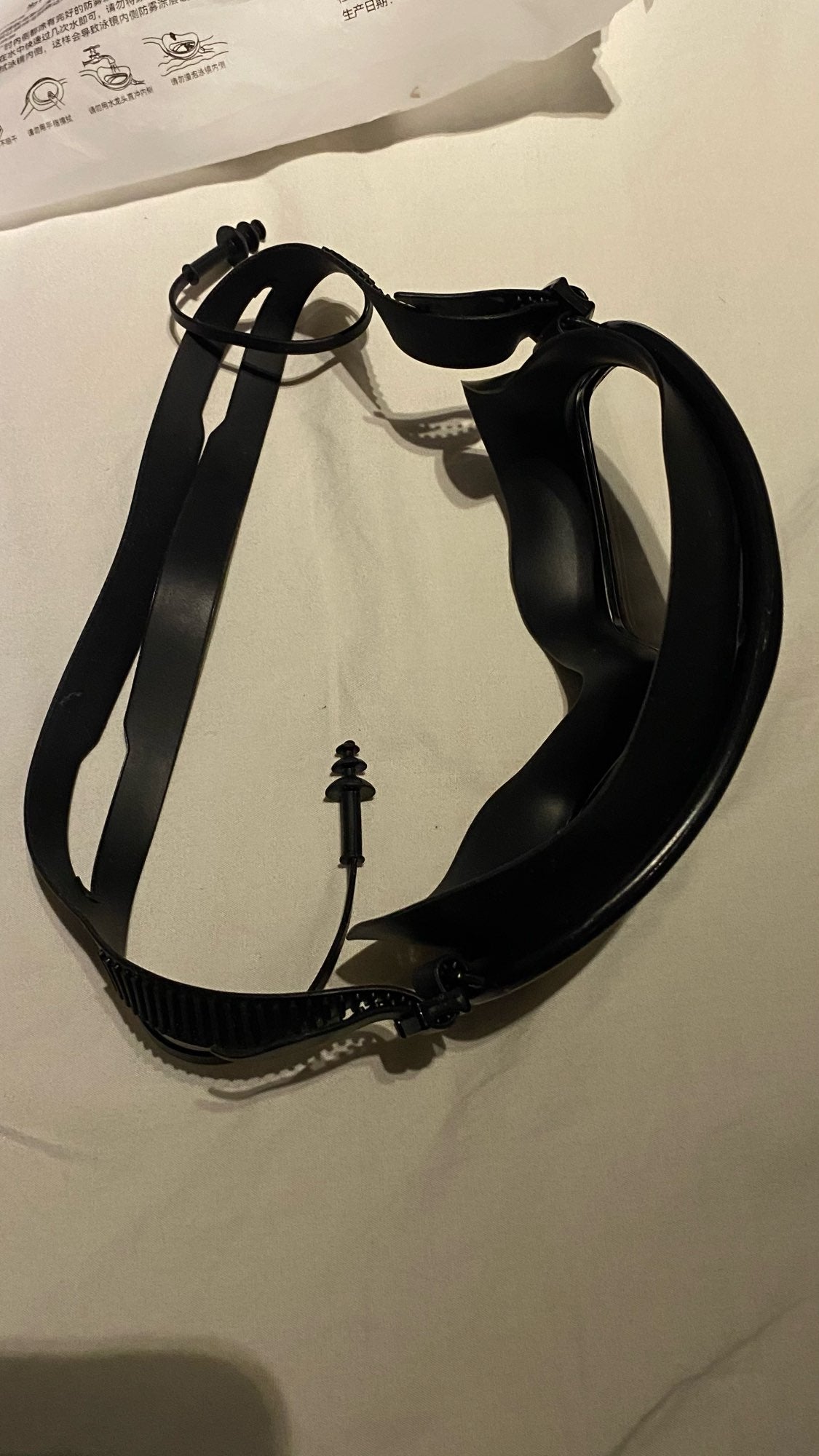 Customer photo - strap and ear plugs detail
